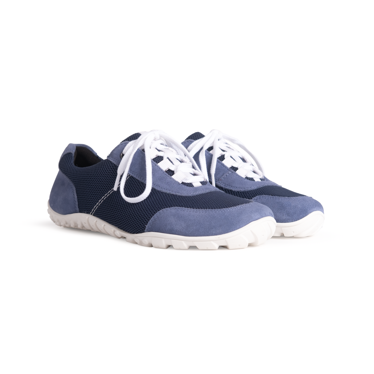 A pair of blue Comfy Barfuß barefoot shoes with white laces and a textured sole.
